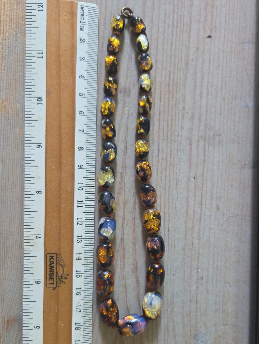 Art Deco Venetian glass necklace features hand-knotted, graduated barrel beads.